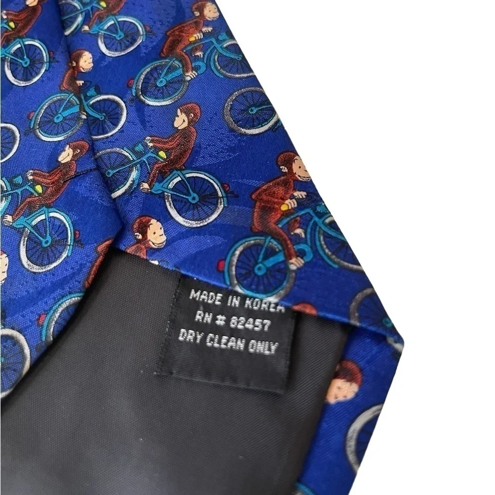Curious George men’s tie 100% Polyester George on a bicycle Novelty Tie blue